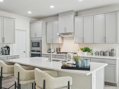 The spacious kitchen features a walk-in pantry, fit for a home chef.