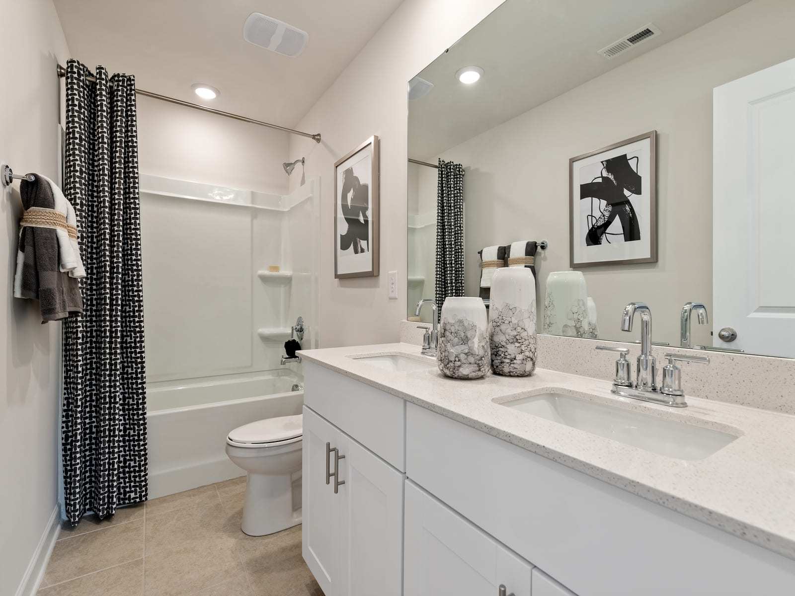 The secondary bath offers a space for guests to refresh and get ready.