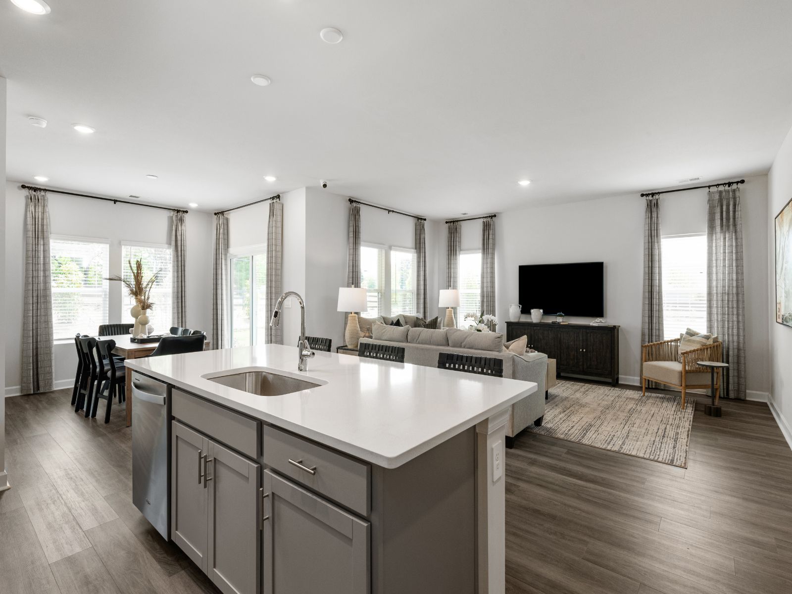 The oversized island is a perfect bar counter for convenience and extra seating.