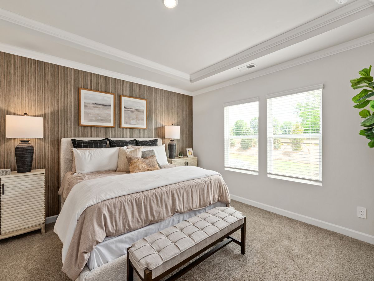 Relax and unwind in the luxurious primary bedroom.