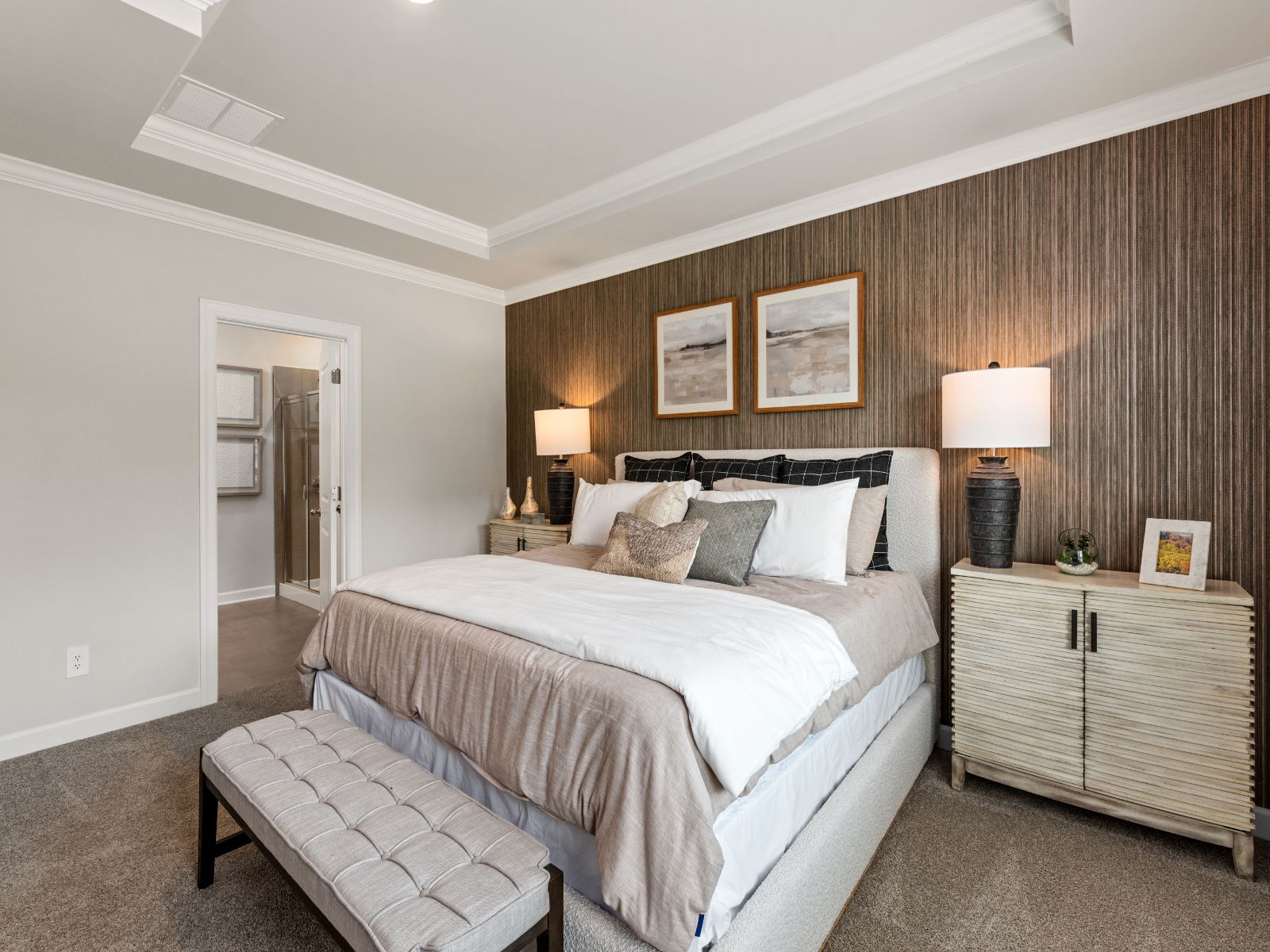 The primary bedroom conveniently connects to a private en-suite.