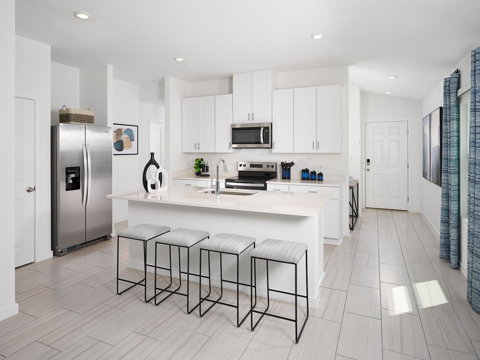 The Acadia floorplan kitchen modeled at Kings Preserve.