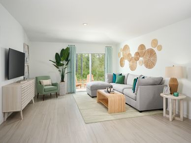 The Acadia floorplan family room modeled at Flagler Village.