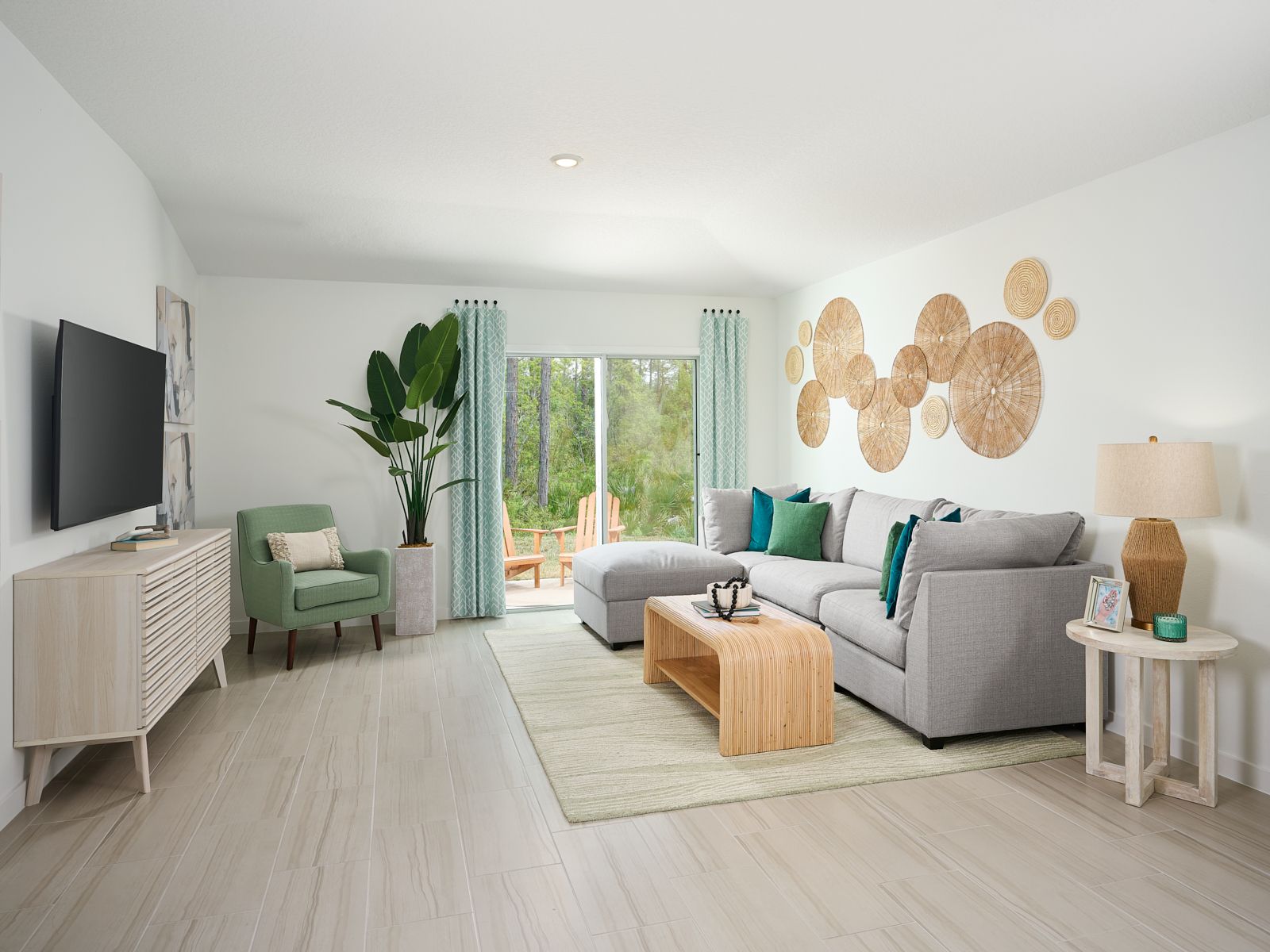 The Acadia floorplan family room modeled at Flagler Village.