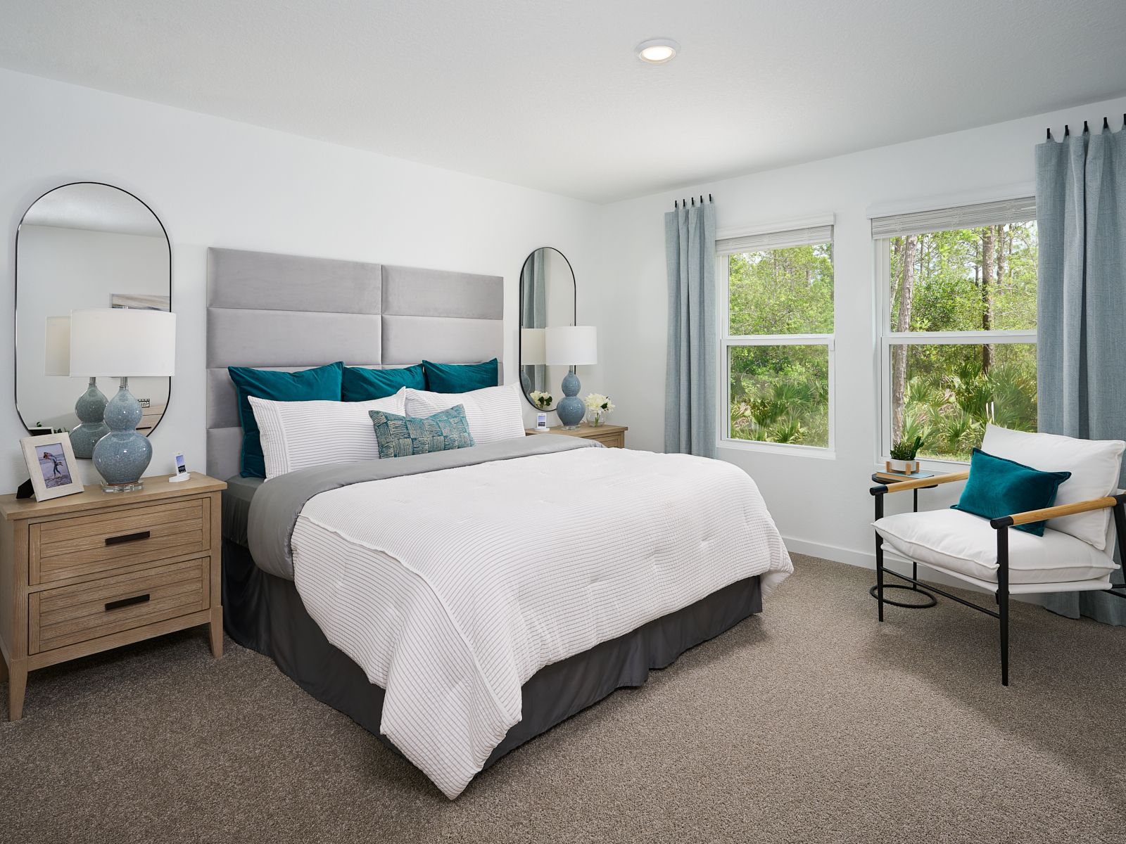 The Acadia floorplan primary bedroom modeled at Flagler Village.
