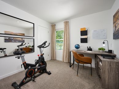 The Acadia floorplan secondary bedroom modeled at Kings Preserve.