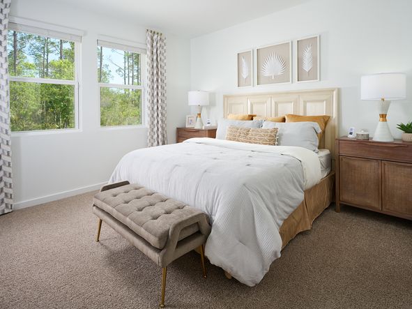 The Azalea floorplan primary bedroom modeled at Flagler Village.