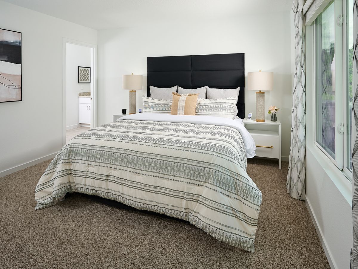 The Davenport floorplan primary bedroom modeled at Kings Preserve.