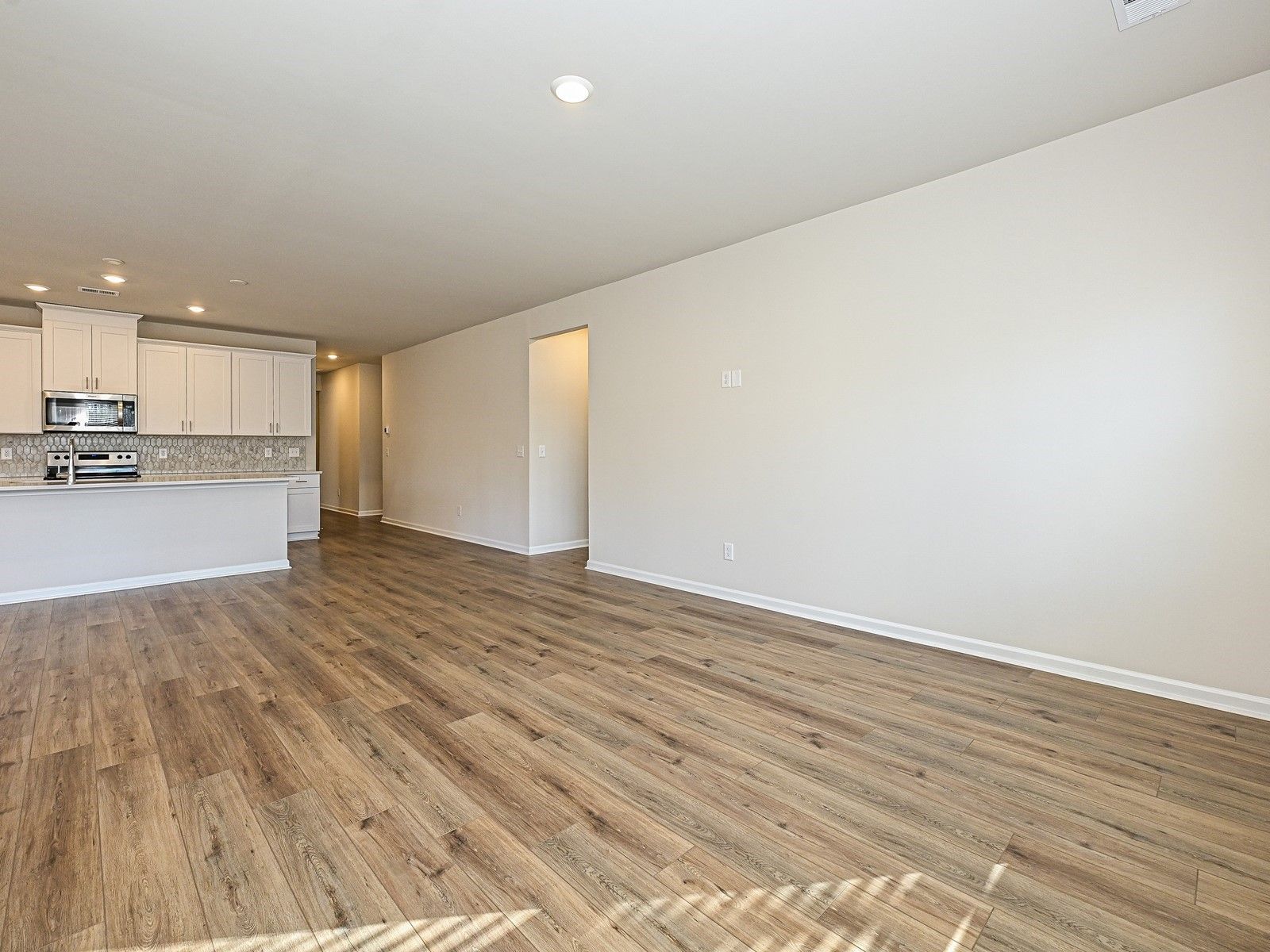 The great room and kitchen lead conveniently to the Gibson's bedrooms.