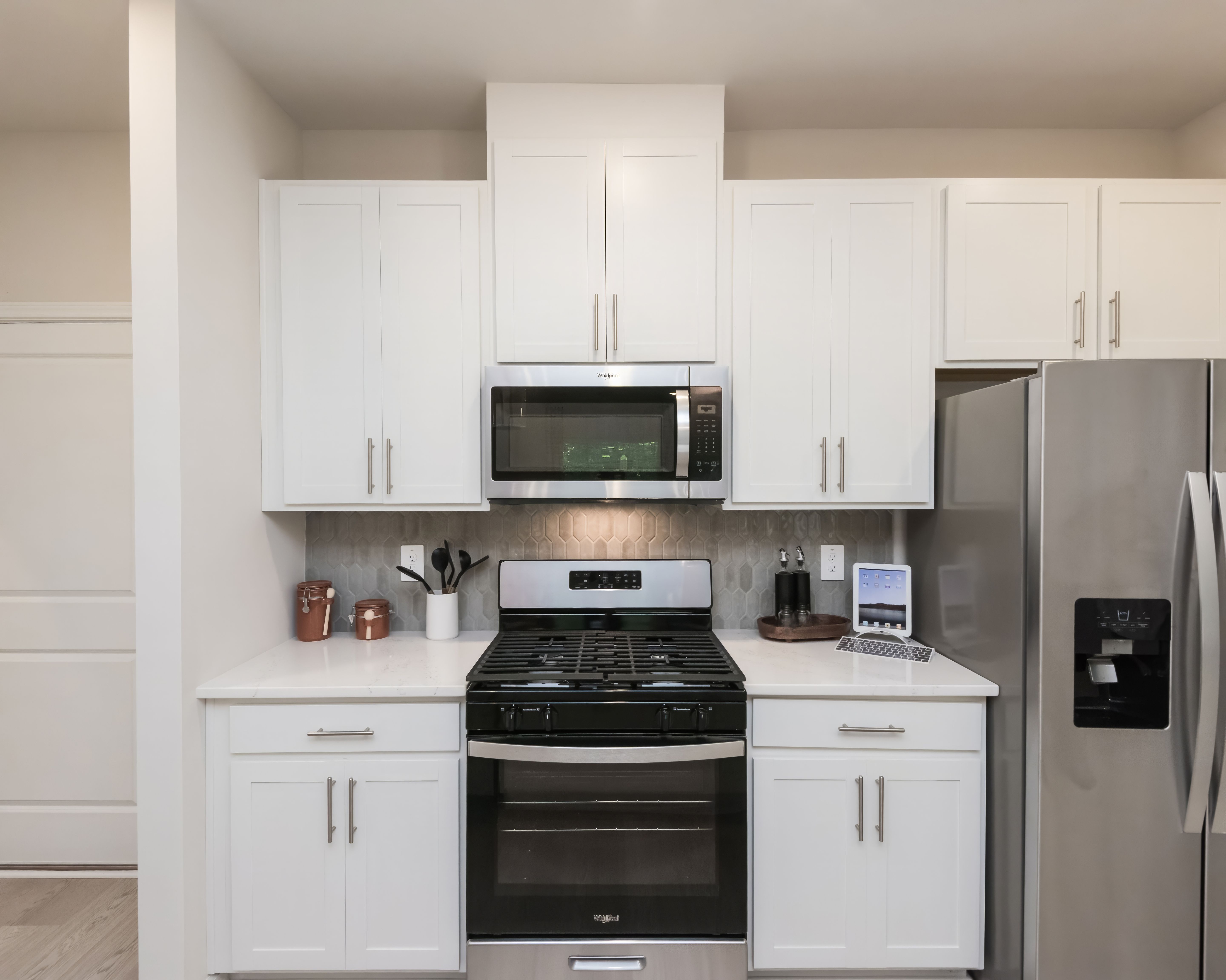 Stylish cabinets and a sleek stovetop add charm and function to your kitchen.