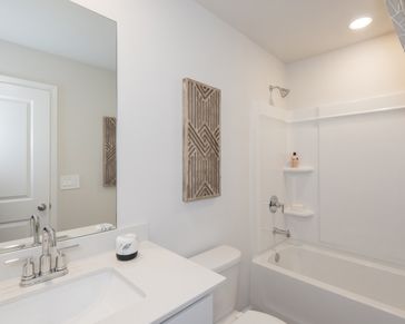 The spacious secondary bathroom gives ample space to get ready in the morning.