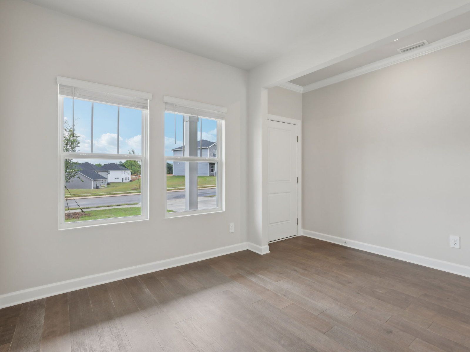 The flex room is perfect for a dining area or home office space.