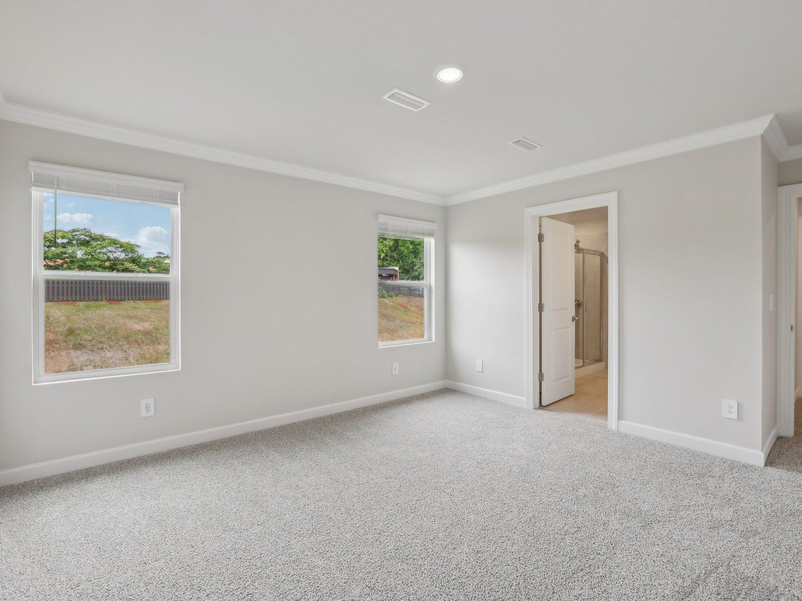 Relax and unwind in the spacious primary bedroom.