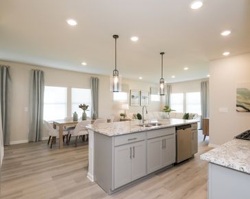 From the kitchen to living room, the open layout keeps everyone close.