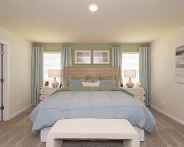 Unwind in this peaceful and spacious primary suite.