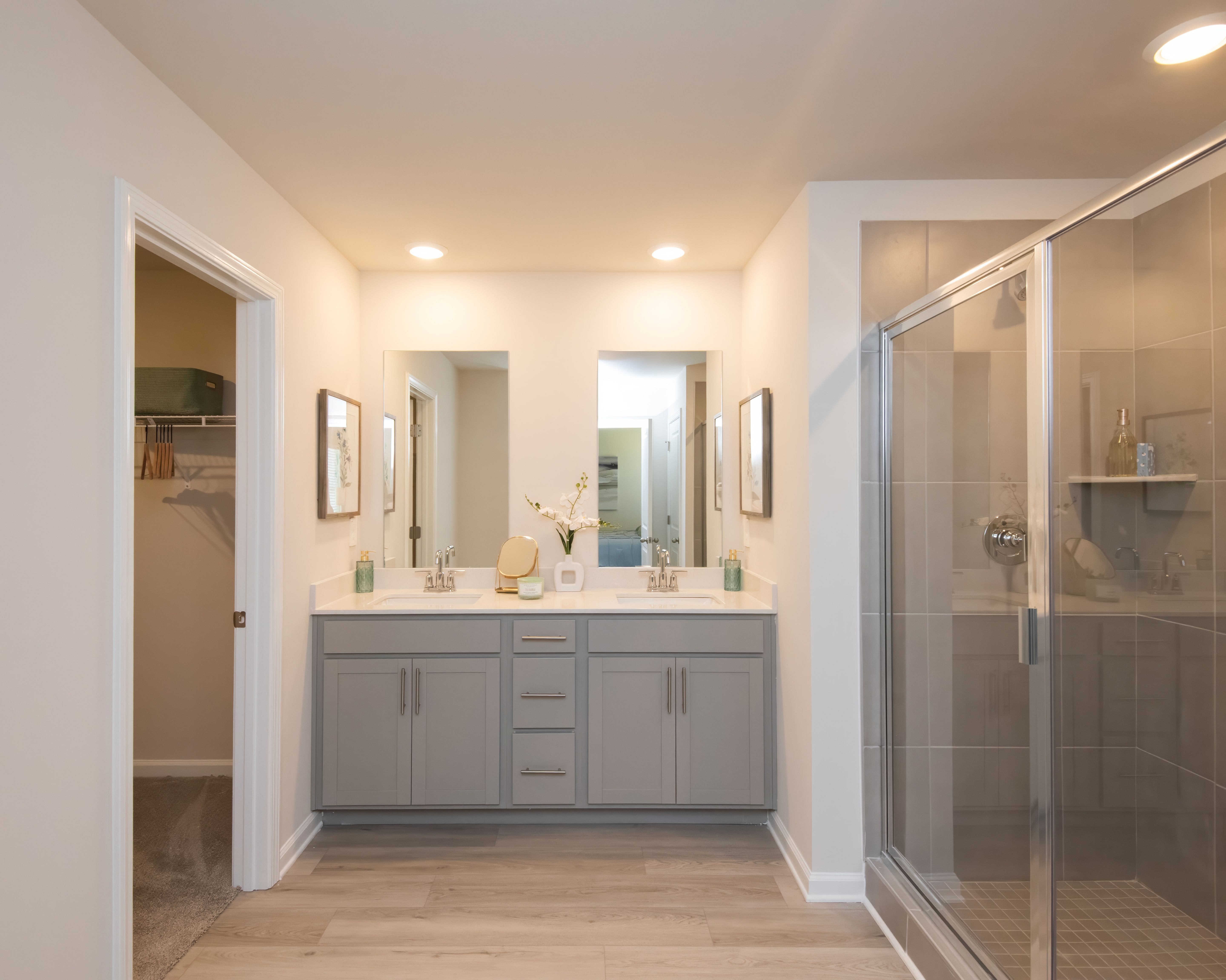 Dual vanities in the primary suite offer style and convenience for two.