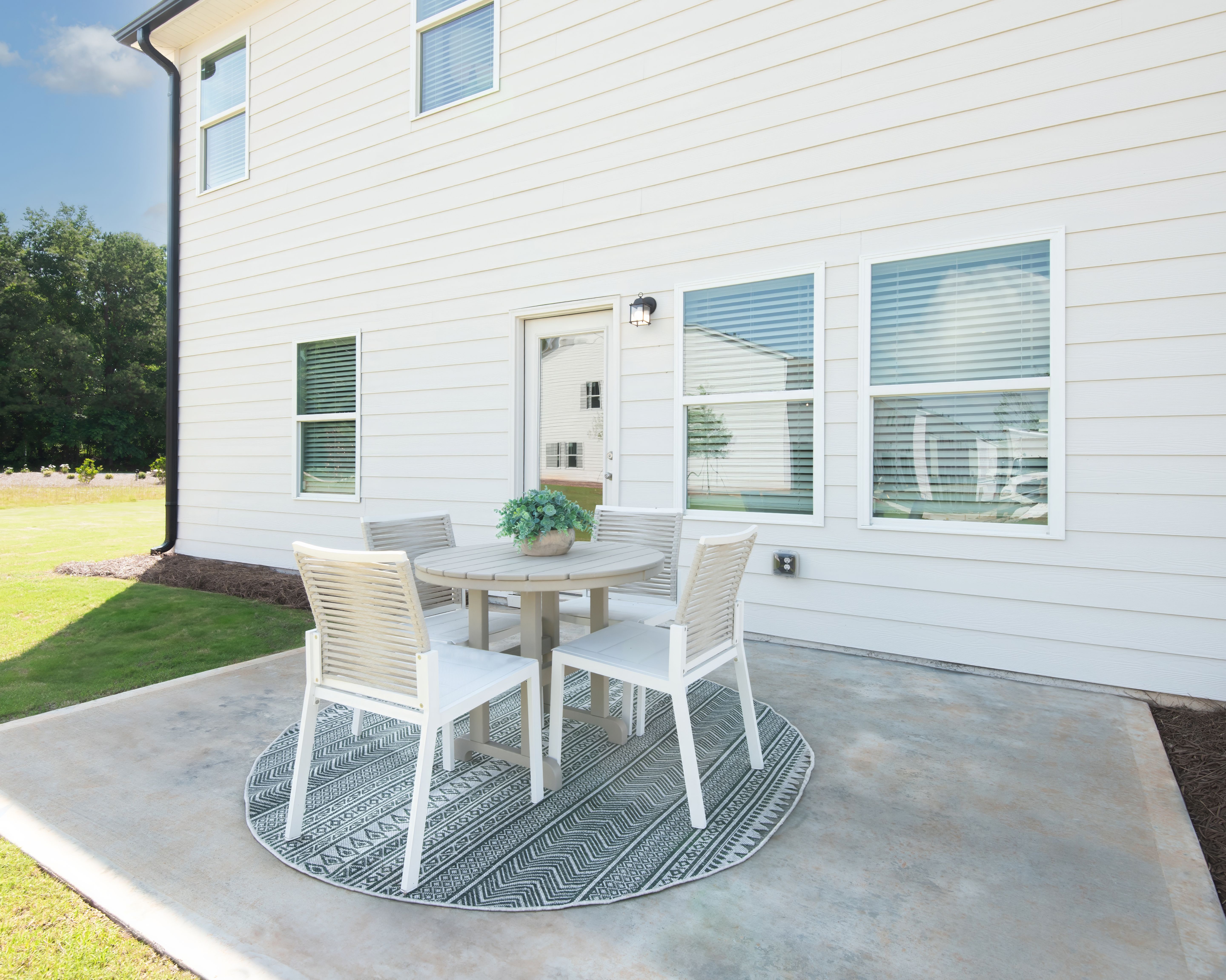 The back patio is perfect for relaxing or entertaining.