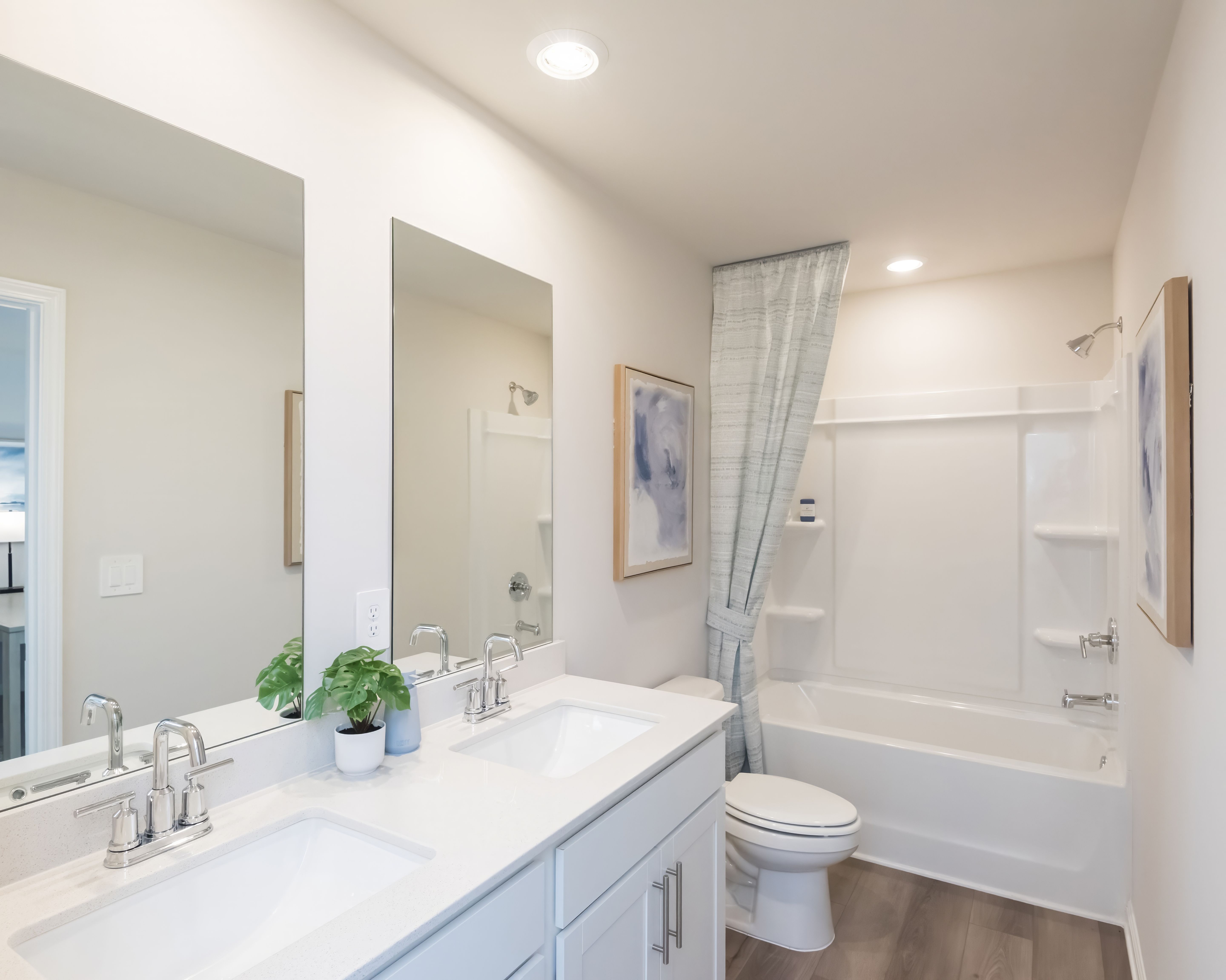A functional and spacious secondary bath for guests or family.