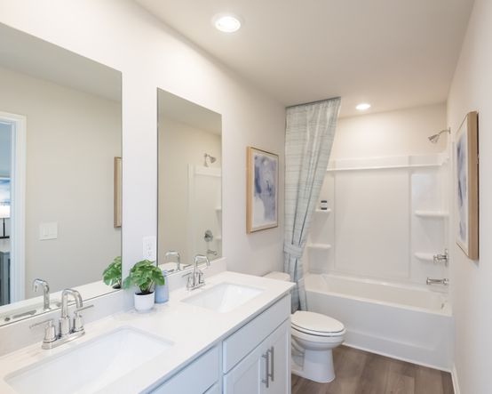 A functional and spacious secondary bath for guests or family.