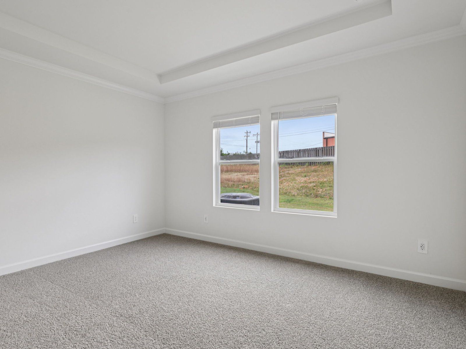 Relax and unwind in the spacious primary bedroom.