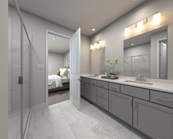 The primary bathroom offers dual vanity sinks and a walk-in shower.
