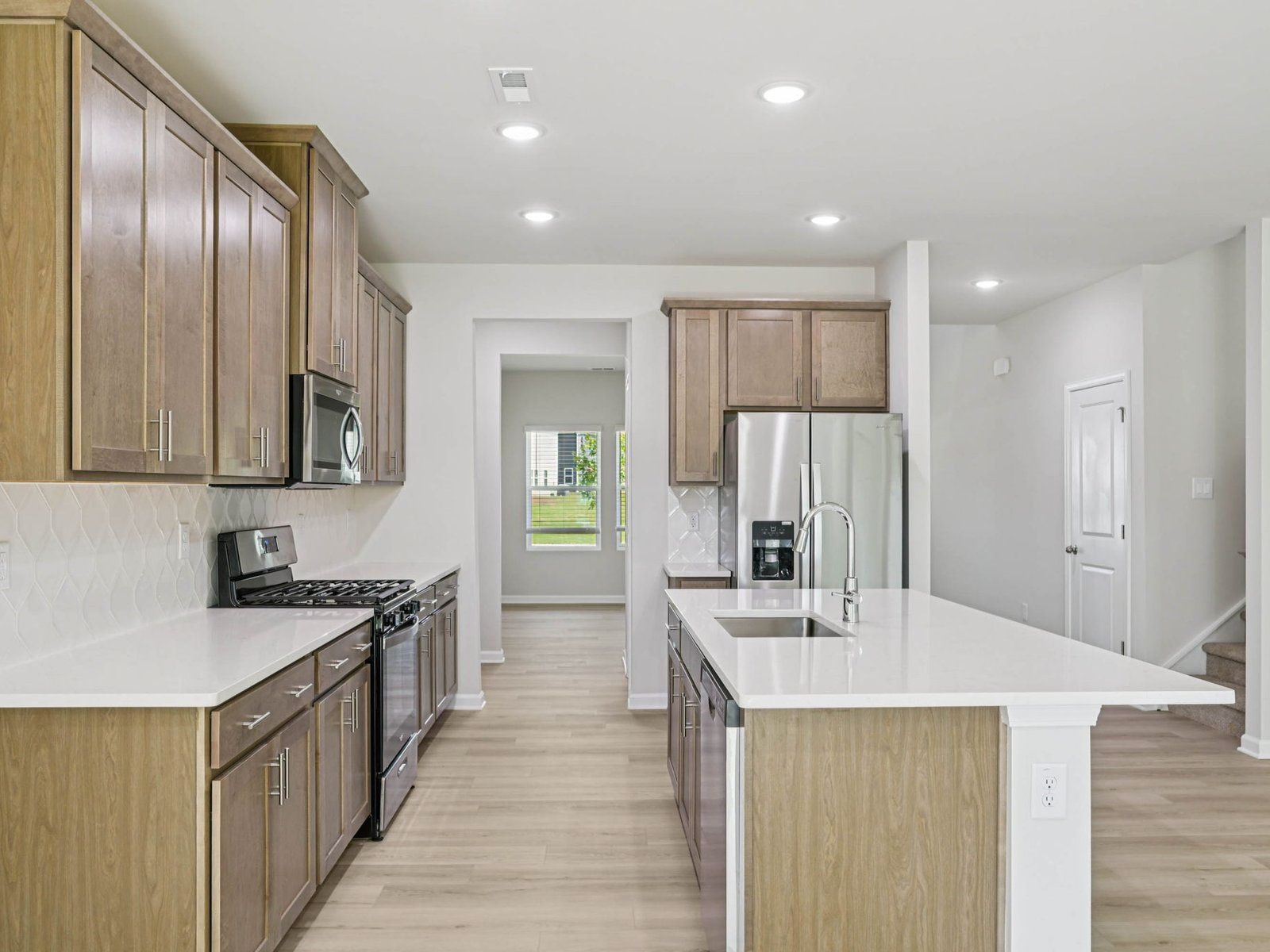 Kitchen in the Johnson floorplan at Cadence Meadows in Zebulon, NC.