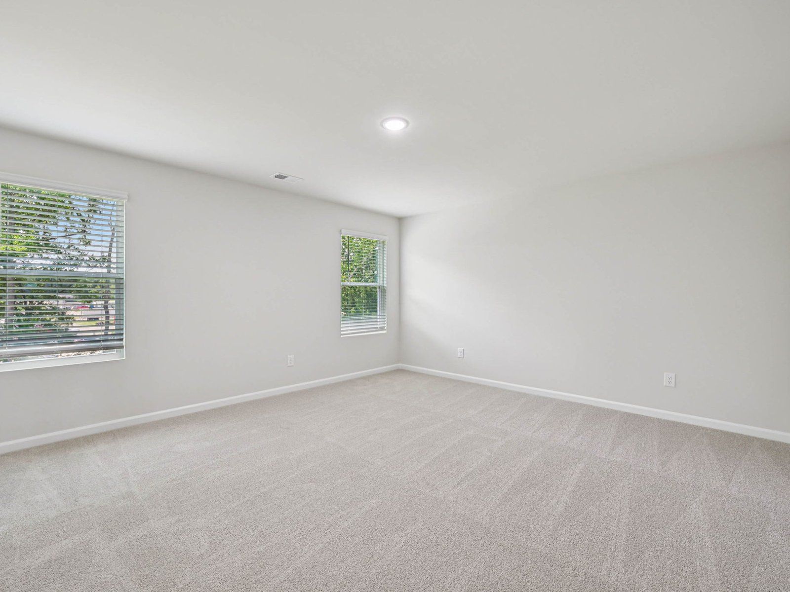 Primary bedroom in the Johnson floorplan at Cadence Meadows in Zebulon, NC.