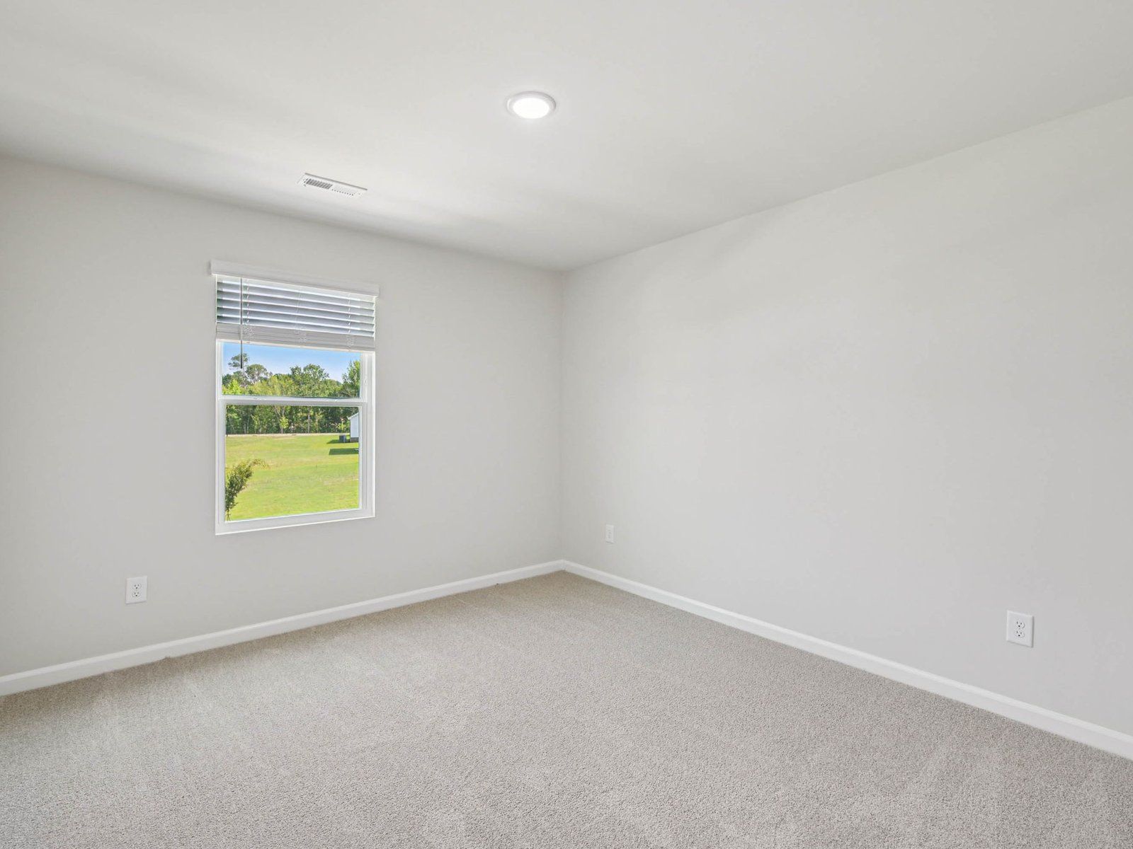 Secondary bedroom in the Johnson floorplan at Cadence Meadows in Zebulon, NC.