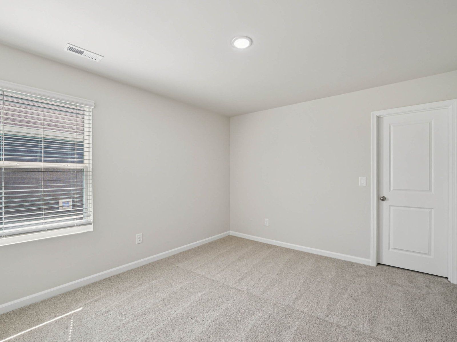 Secondary bedroom in the Johnson floorplan at Cadence Meadows in Zebulon, NC.