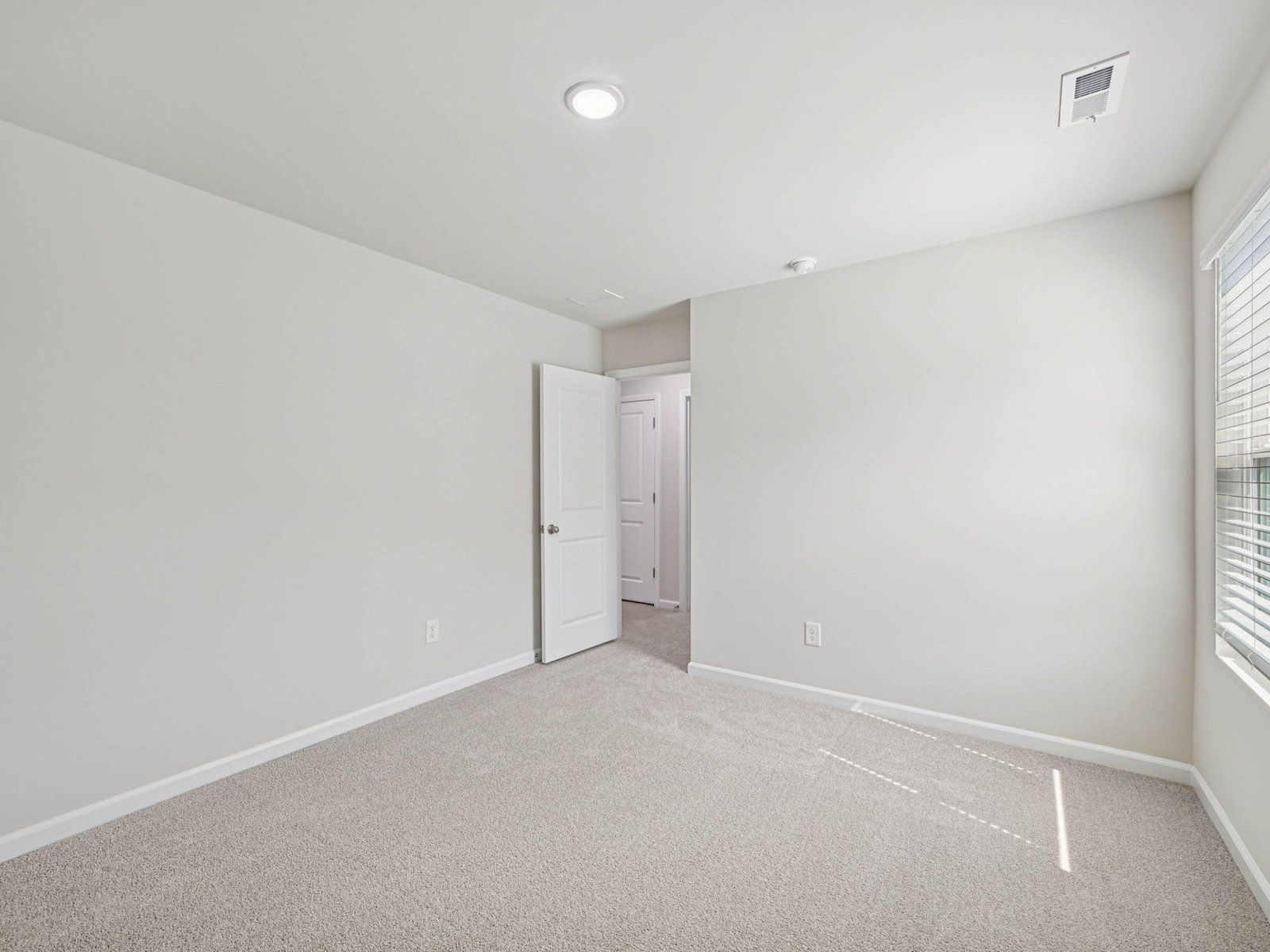 Secondary bedroom in the Johnson floorplan at Cadence Meadows in Zebulon, NC.