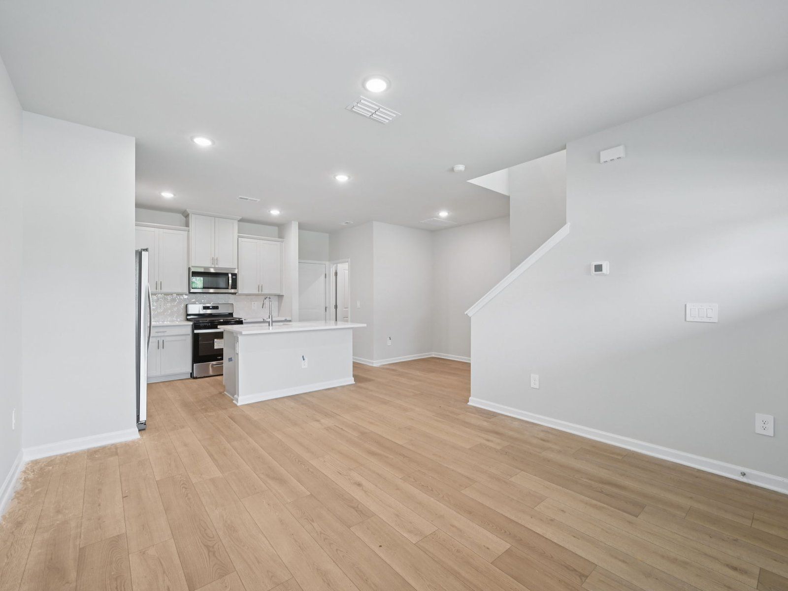 Great room in the Bloomfield floorplan at Cadence Meadows Townes in Zebulon, NC.