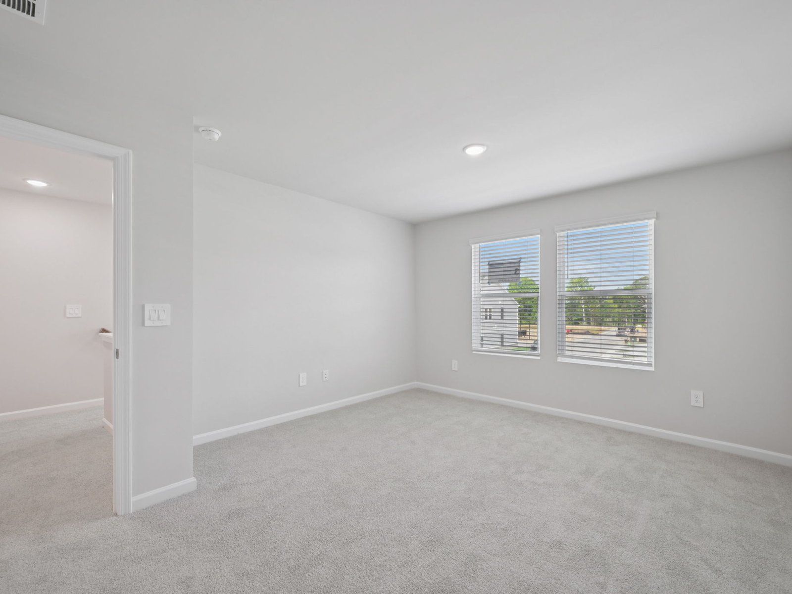 Primary bedroom in the Bloomfield floorplan at Cadence Meadows Townes in Zebulon, NC.