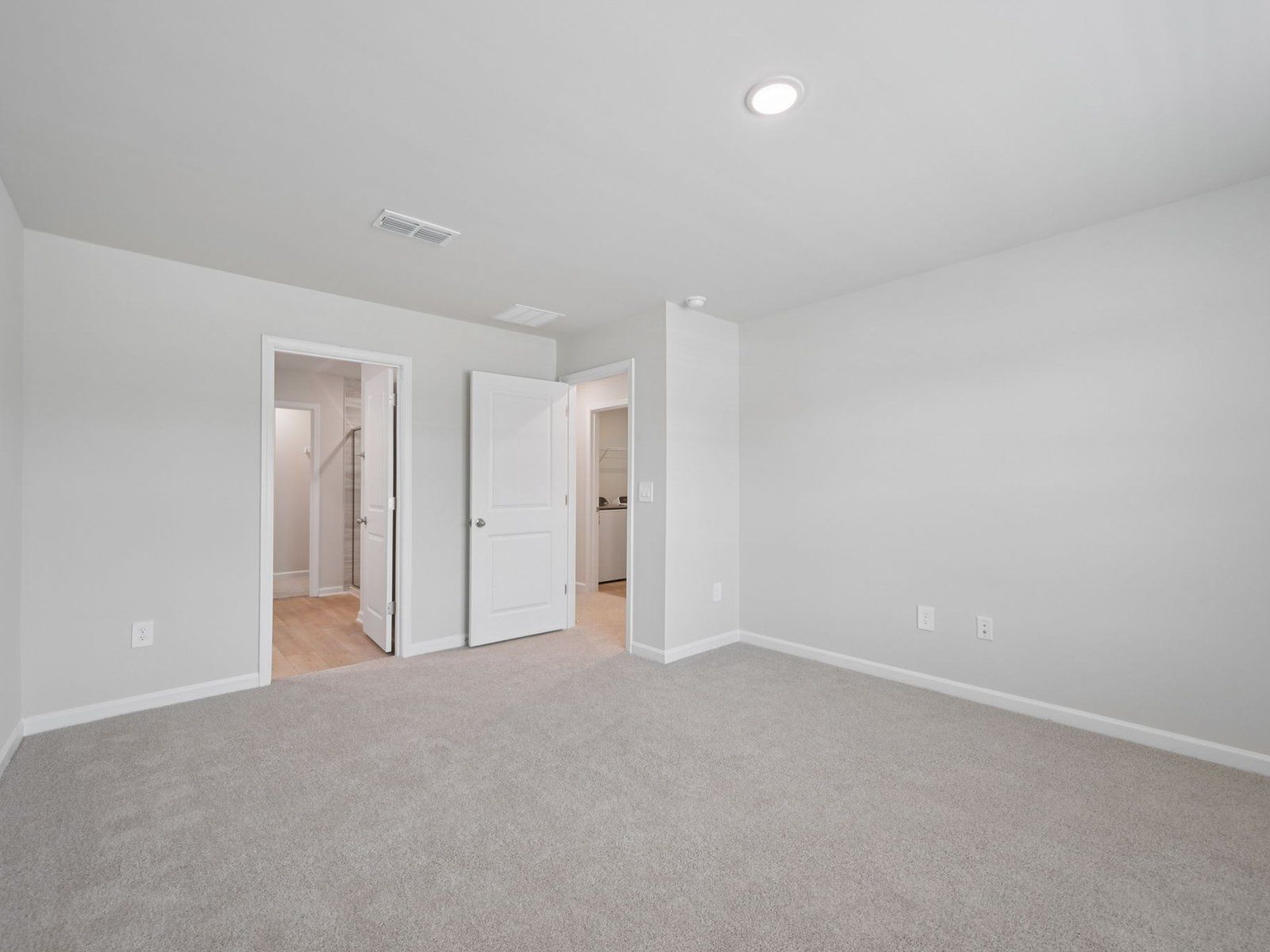 Primary bedroom in the Bloomfield floorplan at Cadence Meadows Townes in Zebulon, NC.