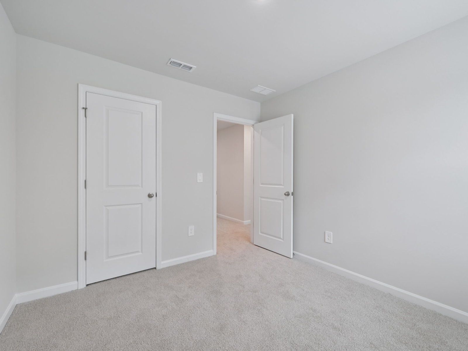 Secondary bedroom in the Bloomfield floorplan at Cadence Meadows Townes in Zebulon, NC.