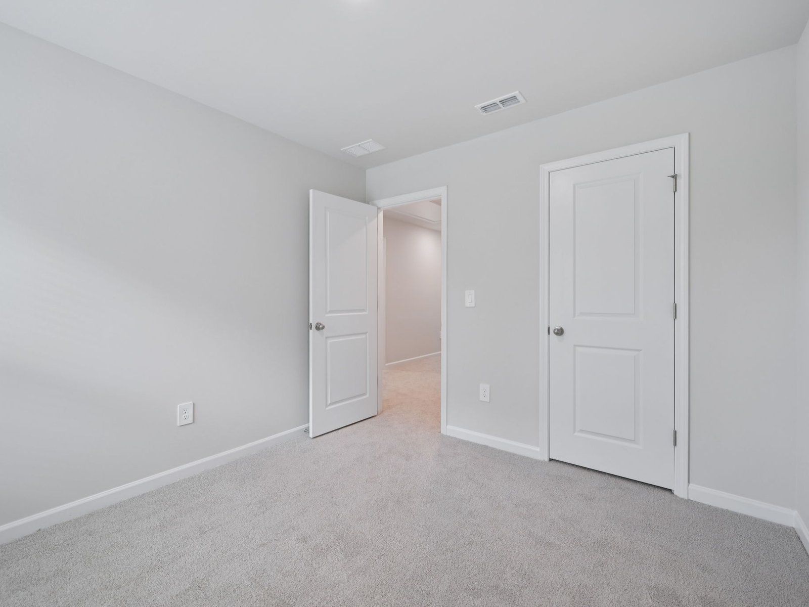 Secondary bedroom in the Bloomfield floorplan at Cadence Meadows Townes in Zebulon, NC.
