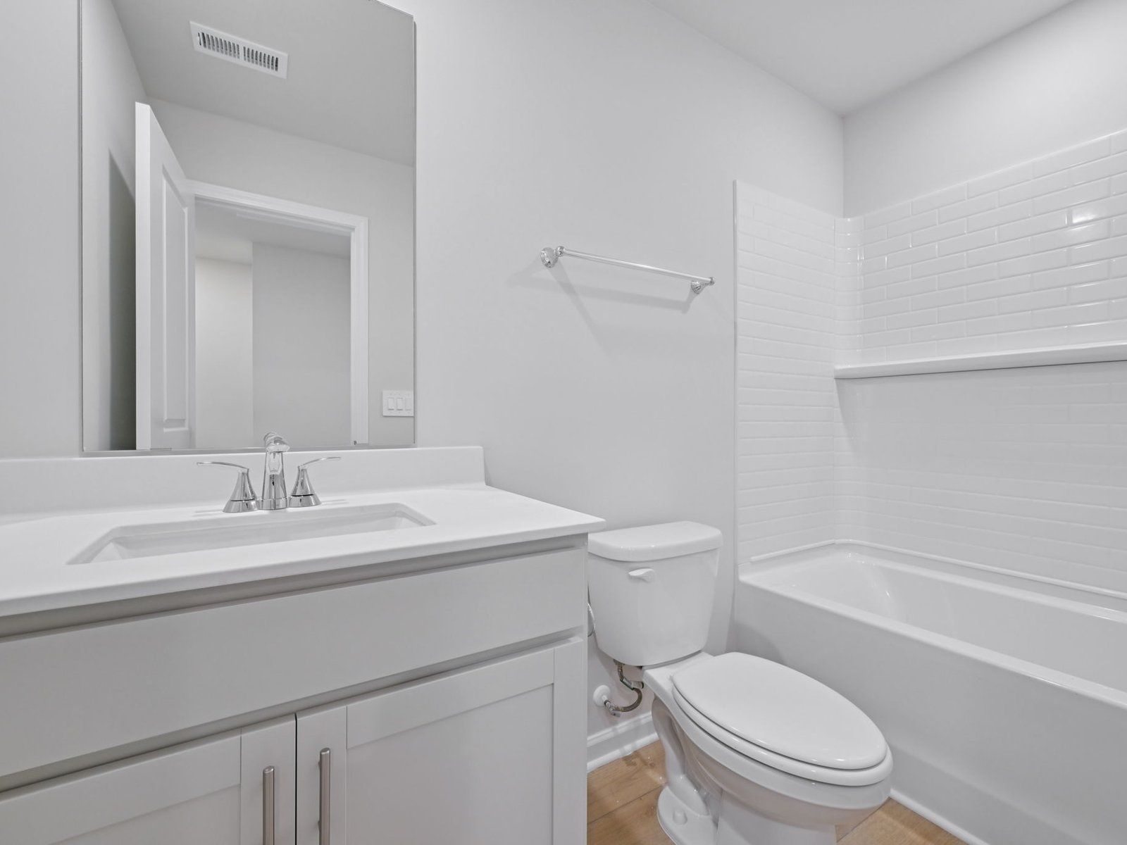Secondary bathroom in the Bloomfield floorplan at Cadence Meadows Townes in Zebulon, NC.