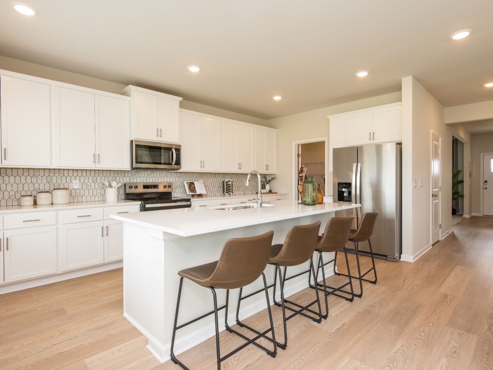 The Dakota floorplan with the Divine White interior package modeled at Walkers Hill.
