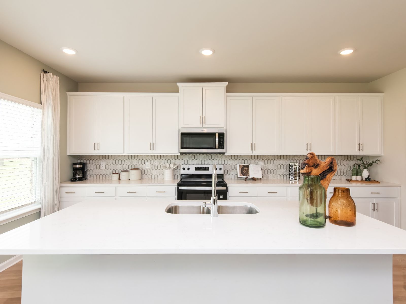 Turn the kitchen island into a functional bar counter for guests.