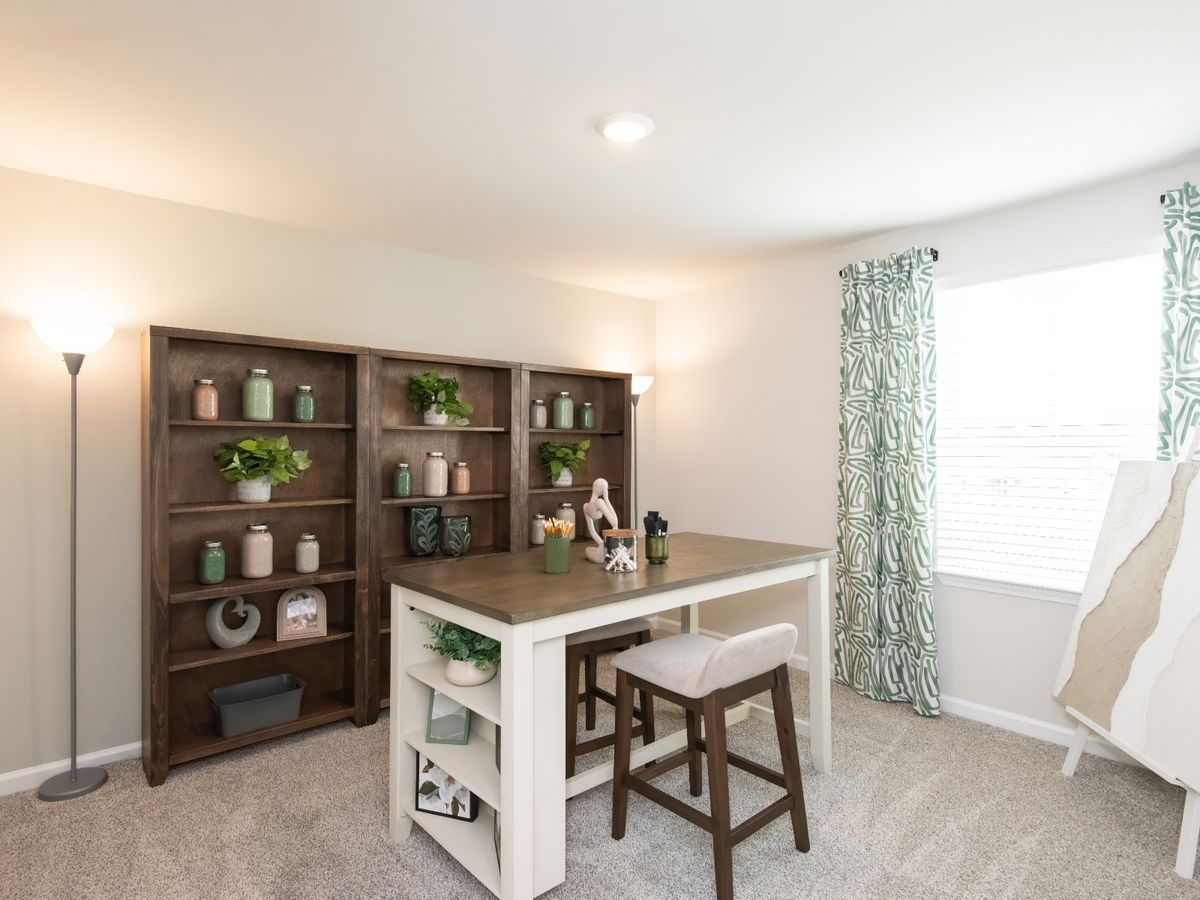 This secondary bedroom makes for a perfect office or craft room.