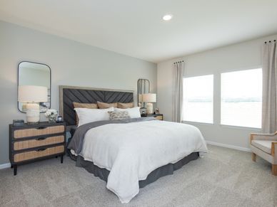 Relax and unwind in the spacious primary bedroom.