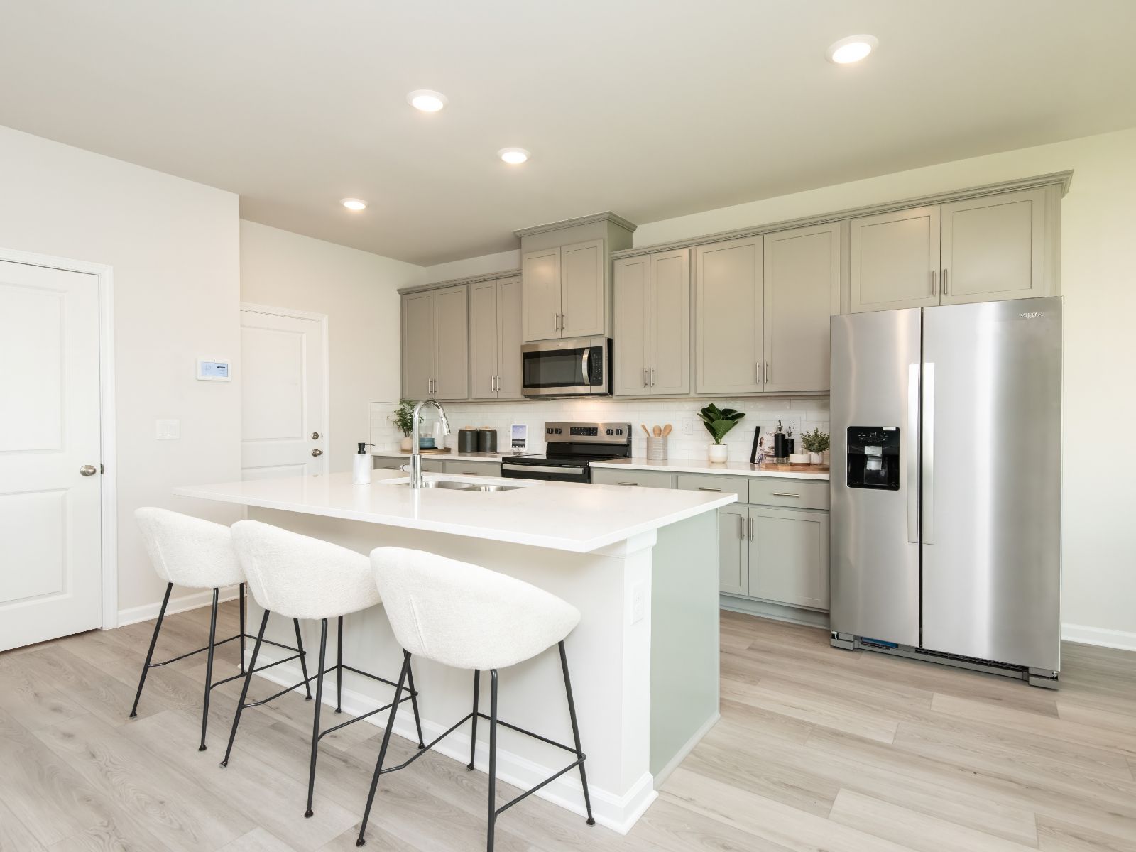 Turn the oversized kitchen island into a bar counter for extra seating.