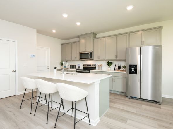 Turn the oversized kitchen island into a bar counter for extra seating.