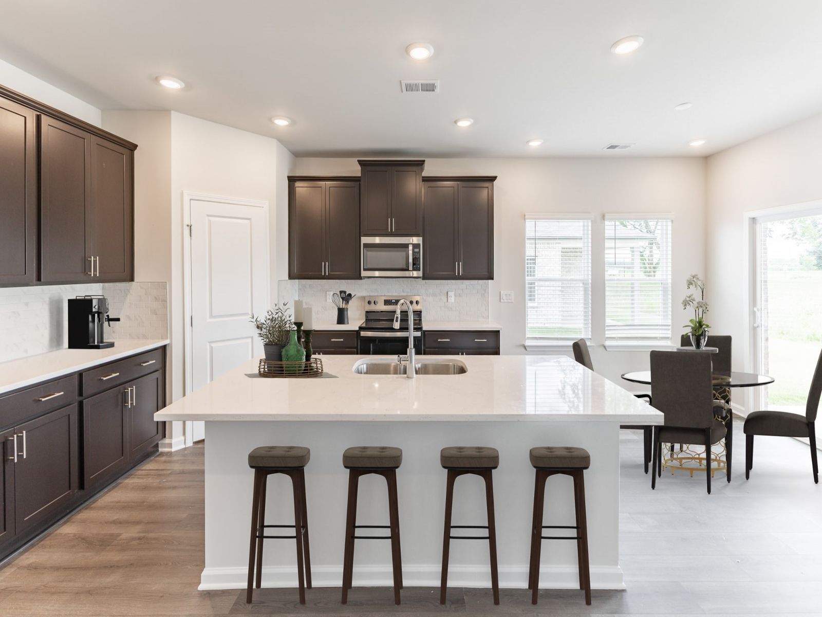 Kitchen in the Newport floorplan with the Balanced Dark interior package.