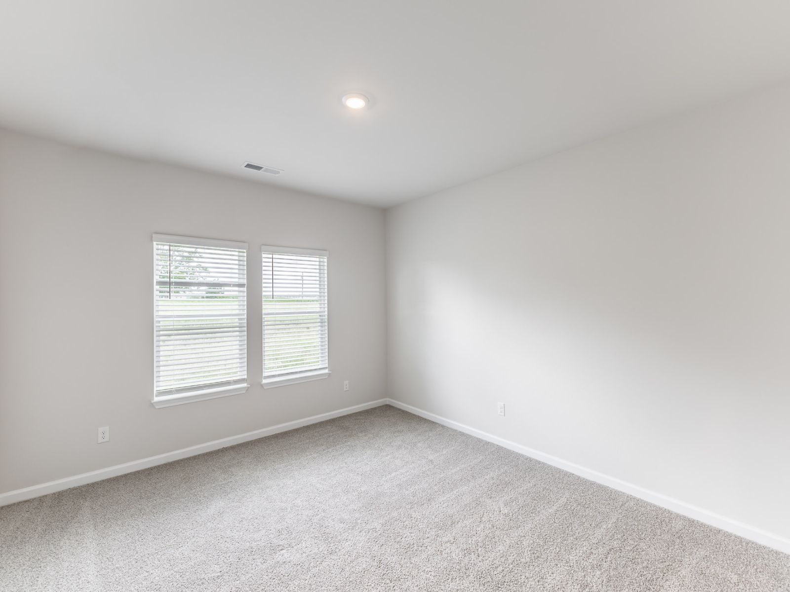Primary Bedroom in the Newport floorplan with the Balanced Dark interior package.