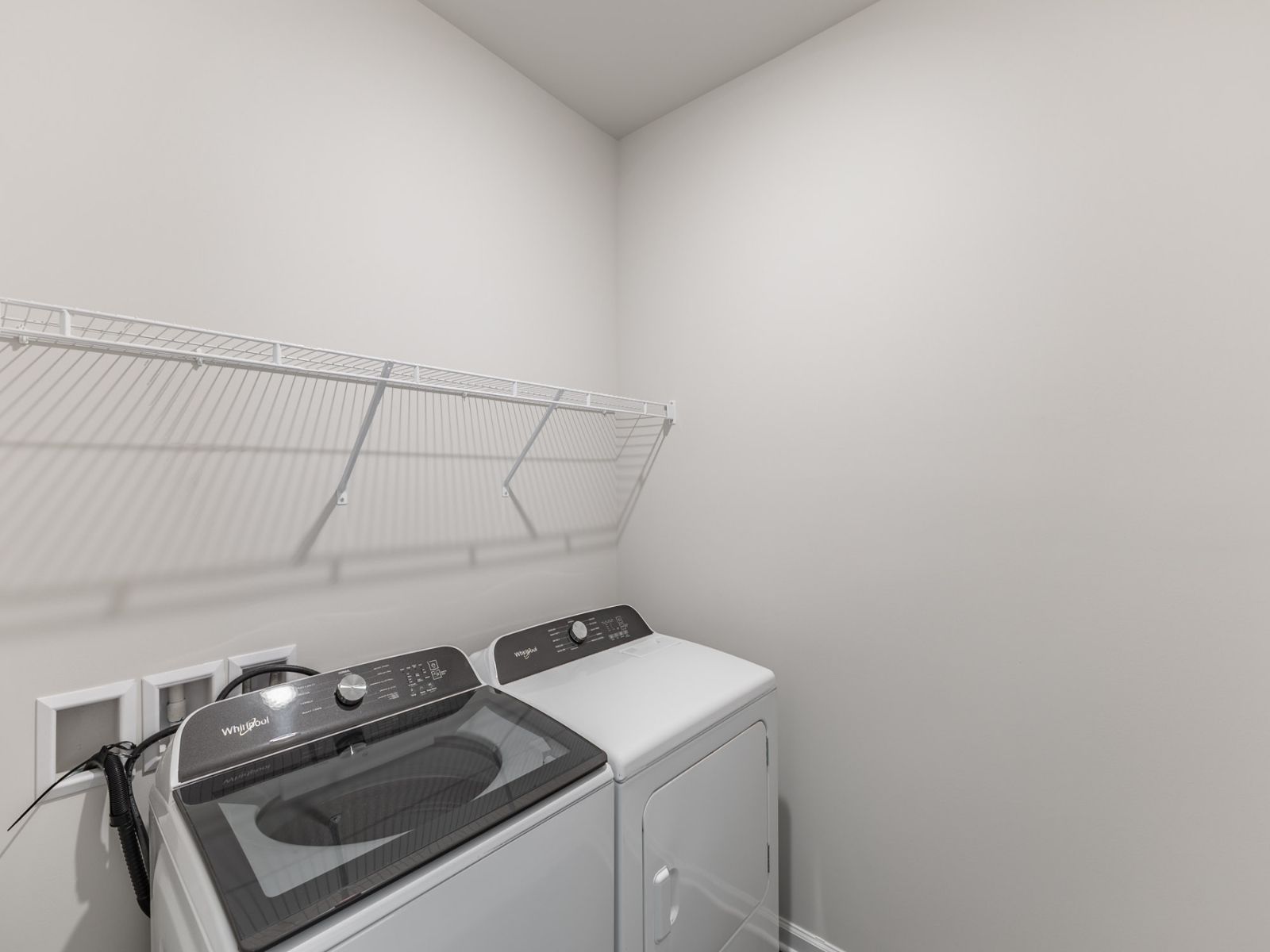 Laundry Room in the Newport floorplan with the Balanced Dark interior package.