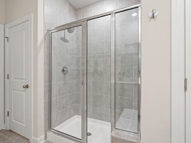 The primary ensuite boasts duel sinks, tile shower and large walk-in closet.