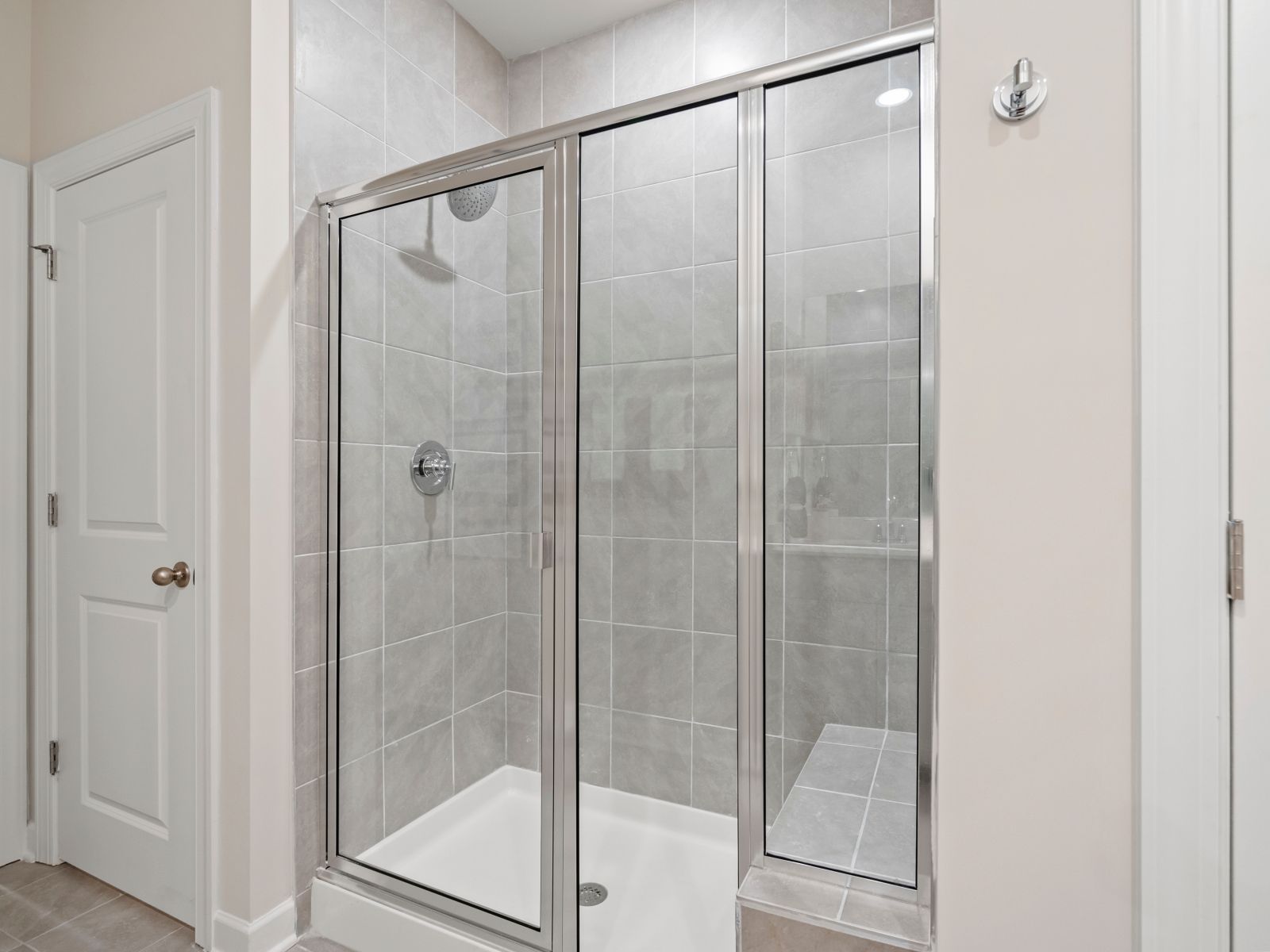 The primary ensuite boasts duel sinks, tile shower and large walk-in closet.