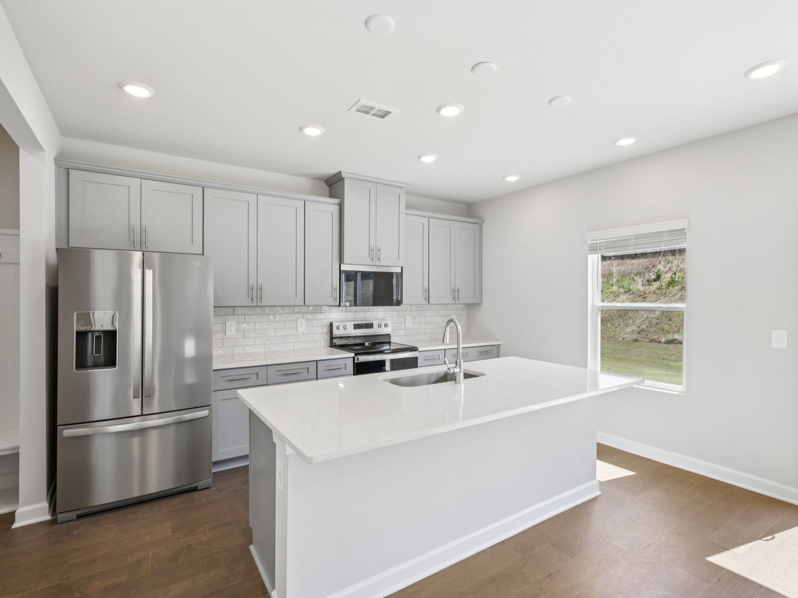 Cook your favorite meals in the sleek, modern kitchen.