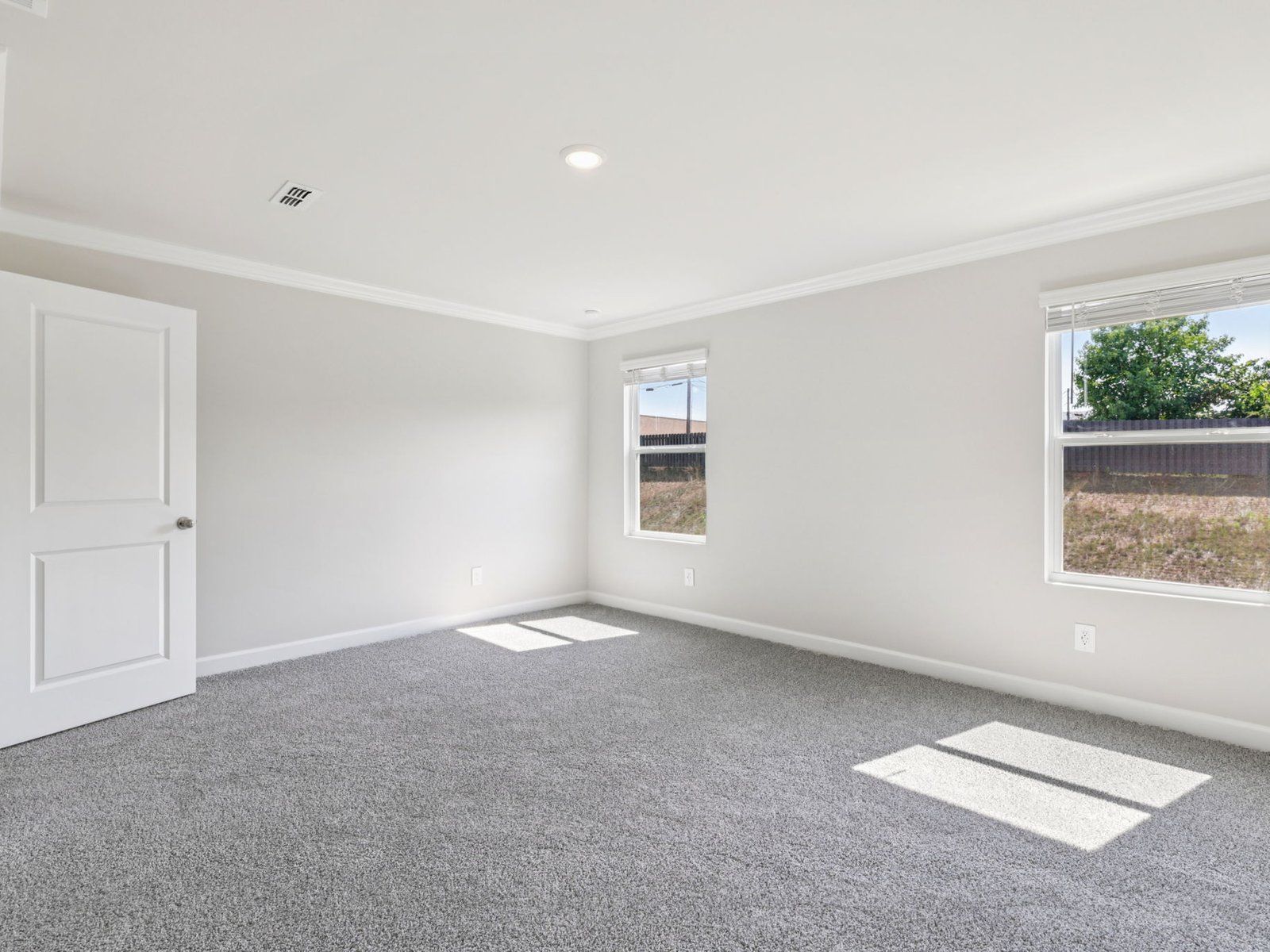 Relax and unwind after a long day in the primary bedroom.