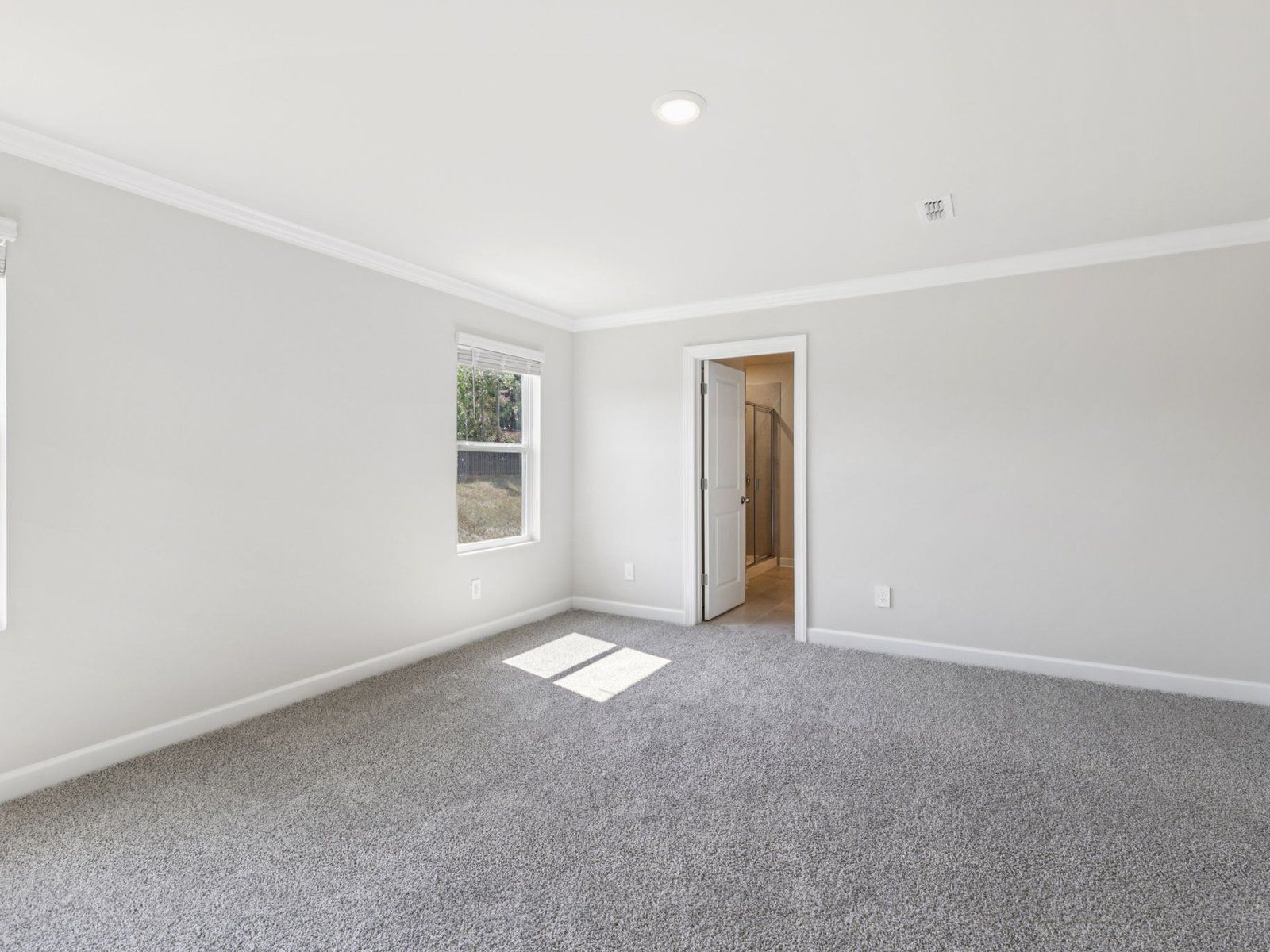 The primary bedroom conveniently leads to your personal ensuite.